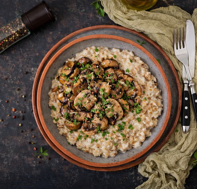 Sauteed mushrooms in savory sauce served over rice with fresh herbs