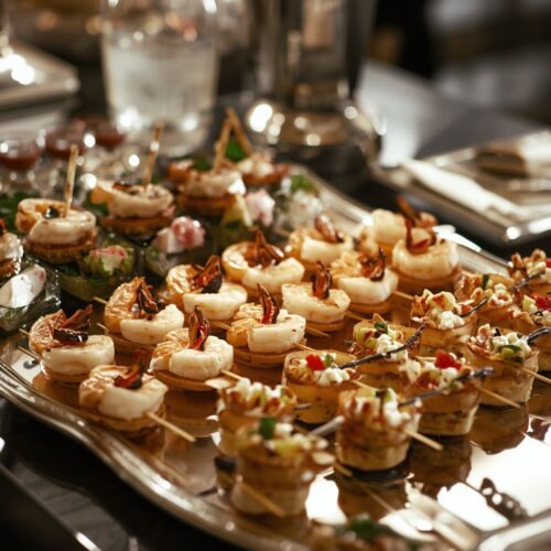 Mini bites with shrimp and vegetables, arranged on a wedding cold buffet table