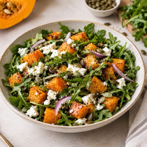 Quick pumpkin salad with roasted pumpkin, feta, arugula and red onion